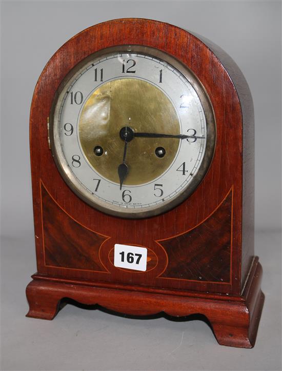 An Edwardian inlaid mahogany eight day mantel clock